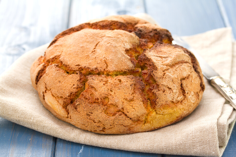 corn bread on napkin with knife